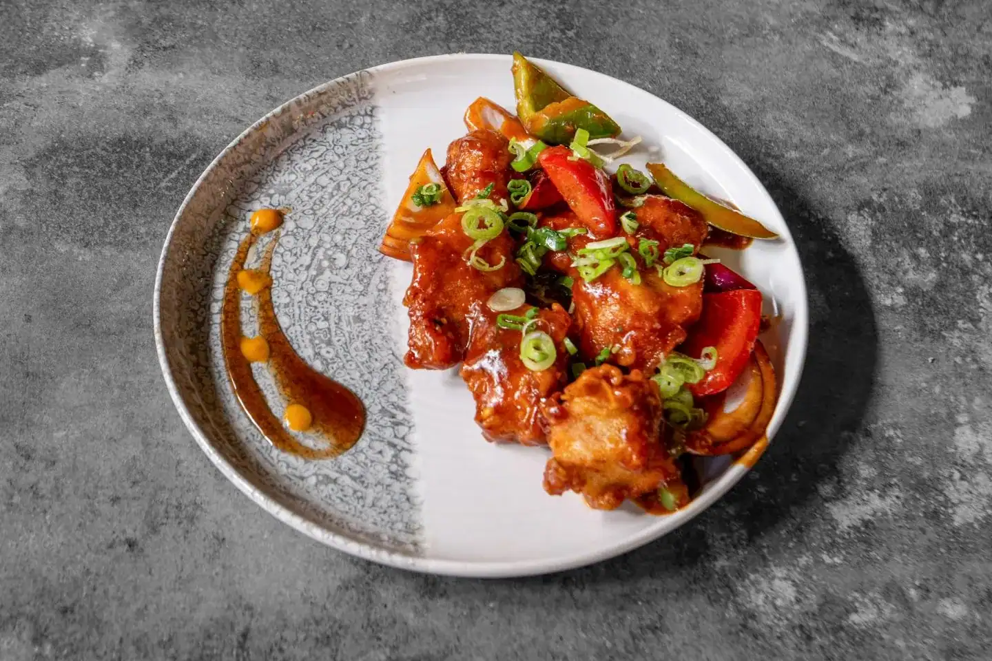 Chilli chicken at Nukkad Café, Glasgow: golden fried chicken tossed with peppers, onions and spicy Indo-Chinese sauces