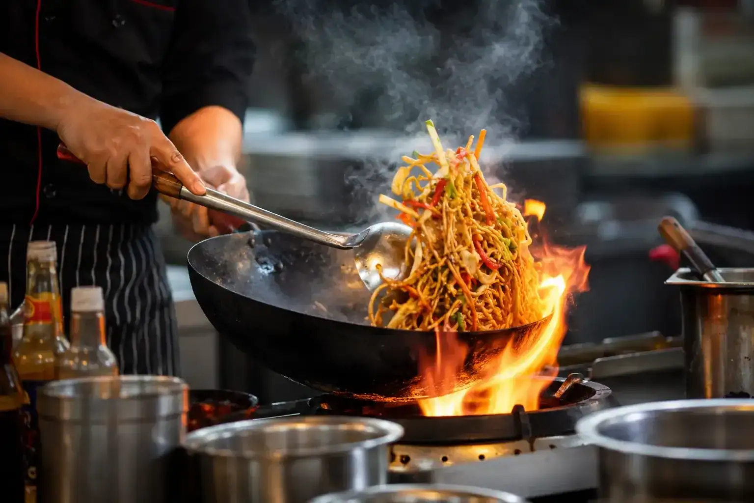 Noodles tossed in a flaming wok
