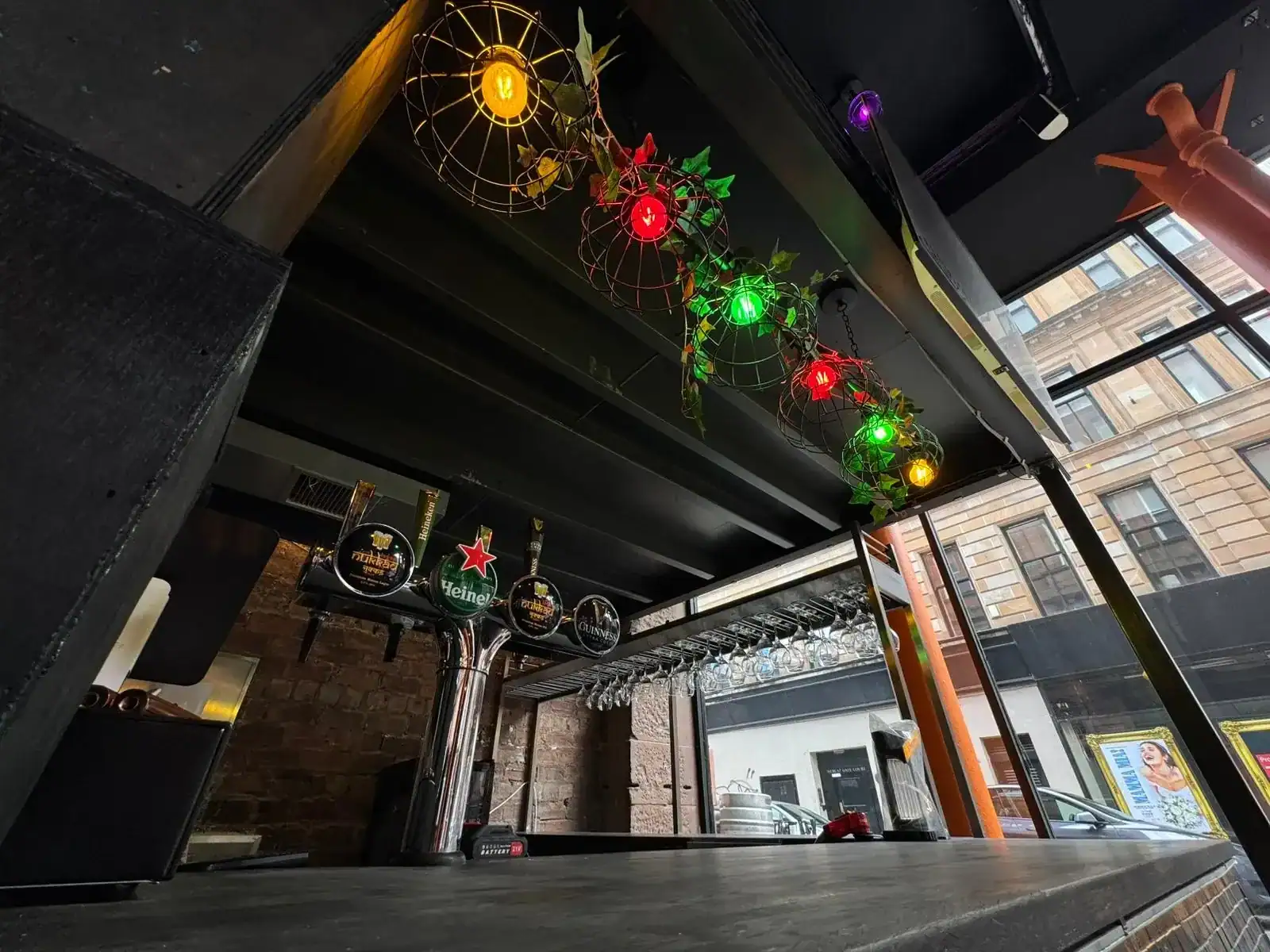 The bar at Nukkad Café under festoon lights